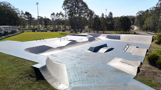 Drone view over Kuraby skatepark street section, banks and transition